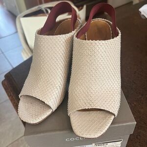 Great open toe snakeskin sling with elastic back to stay on! Wood heel!